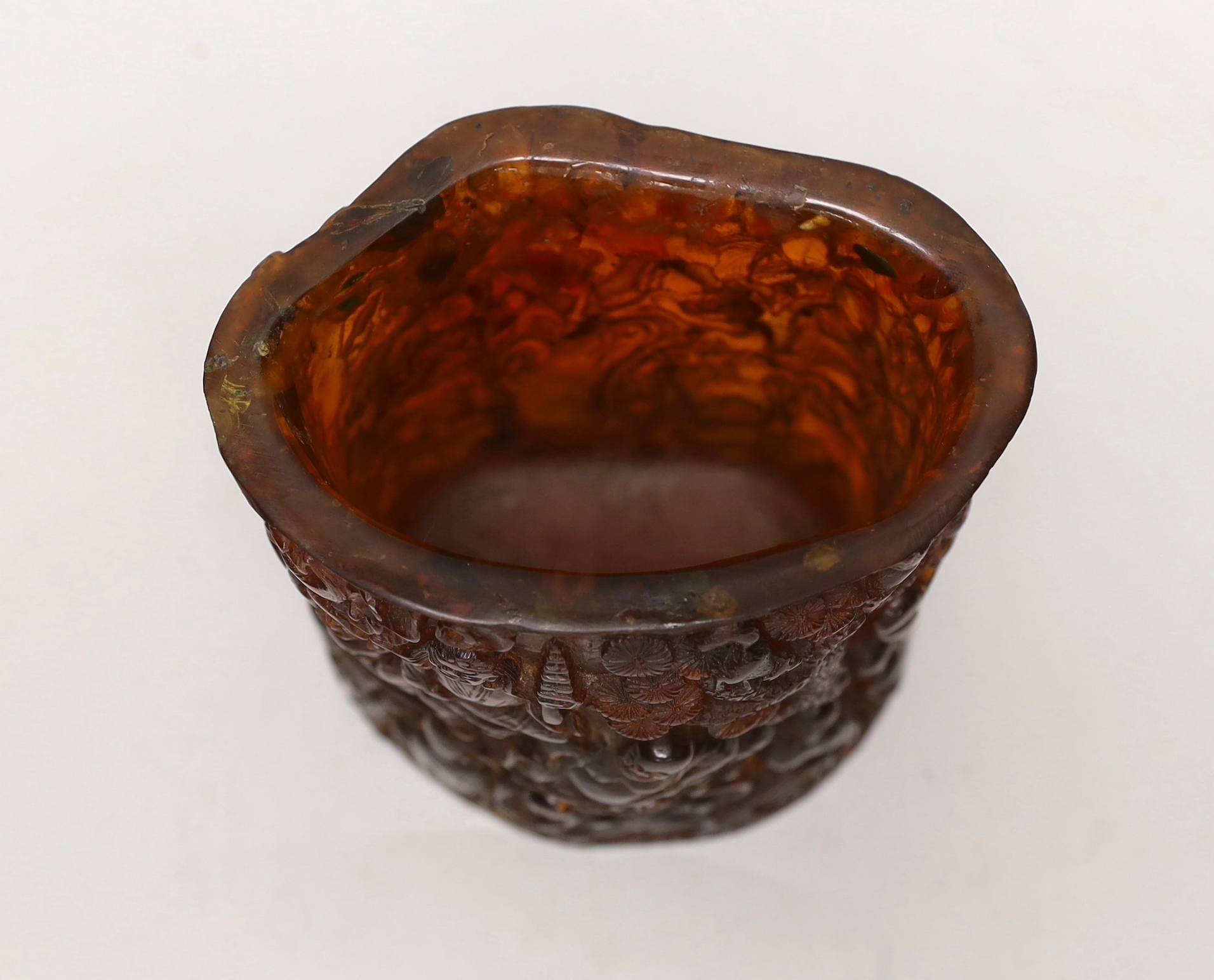 A Chinese amber coloured moulded plastic brush pot, 13.5cm